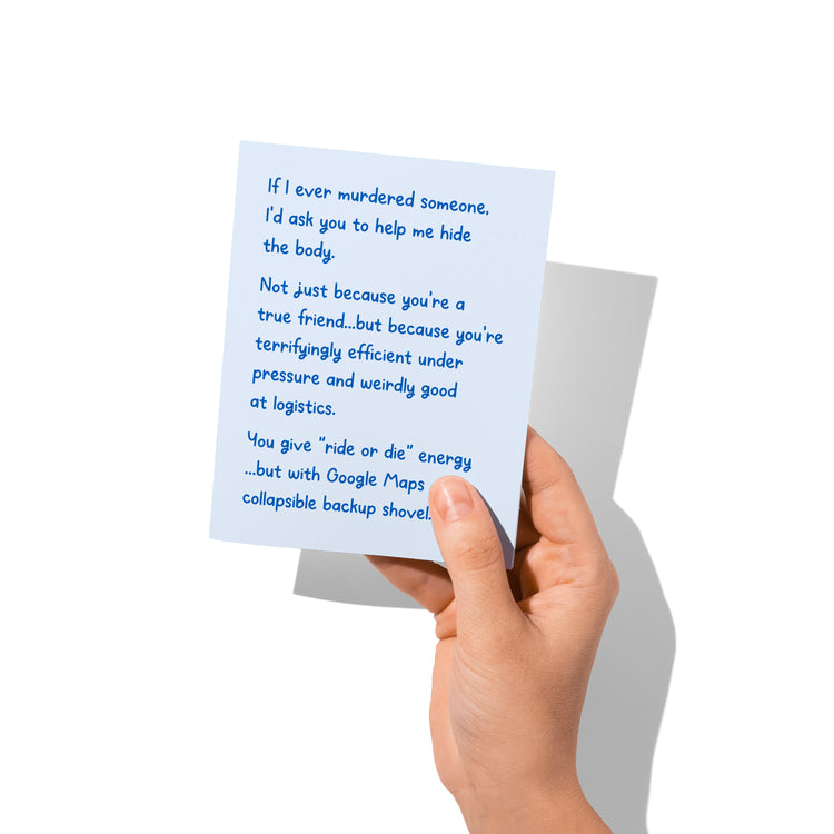 Funny friendship card held in hand, humorous ride-or-die message visible.