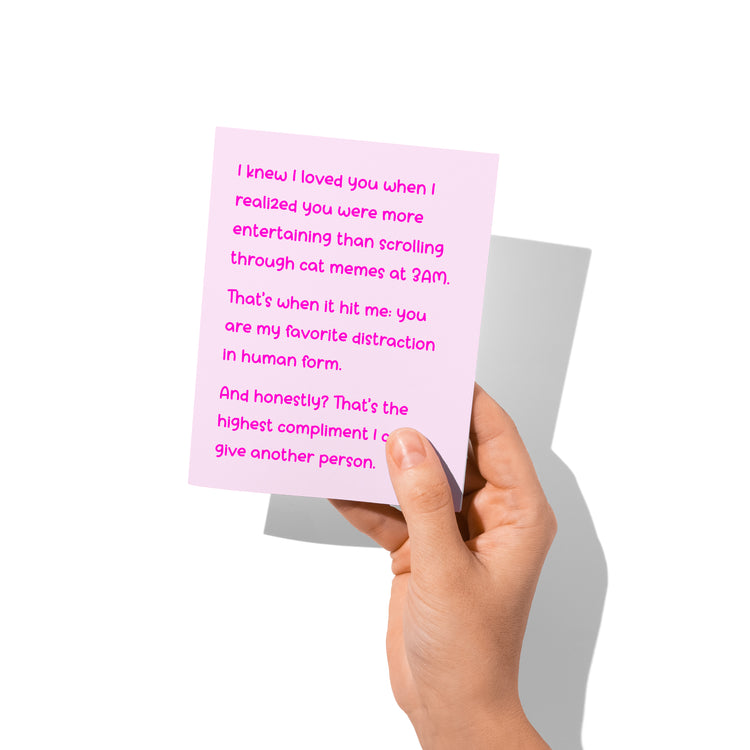 Funny love card held in hand, humorous romantic message visible.