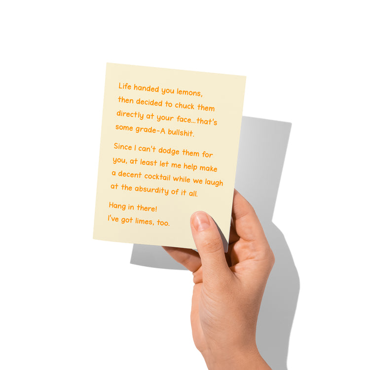 witty sympathy card held in hand, humorous lemons and limes message visible.