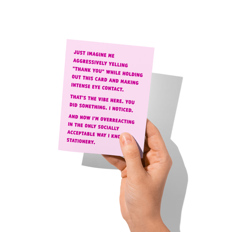 Funny thank you card held in hand, humorous snarky gratitude message visible.