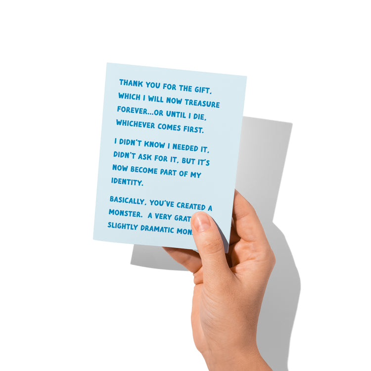 Hand holding thank you card (front visible) to show scale and print quality.