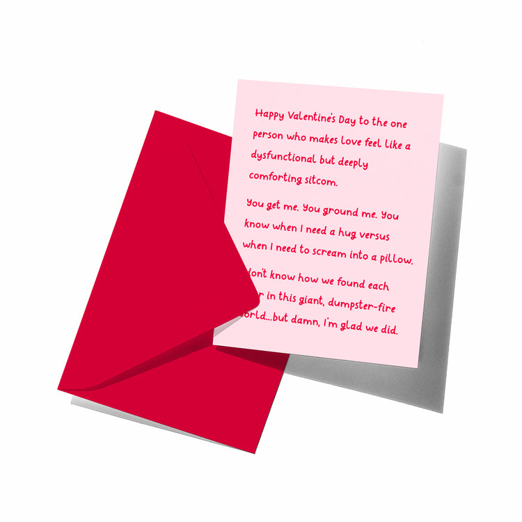 Valentine's Day card with pink interior and red envelope on a white background
