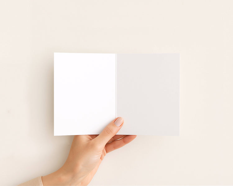 Funny new baby greeting card open to show blank inside.