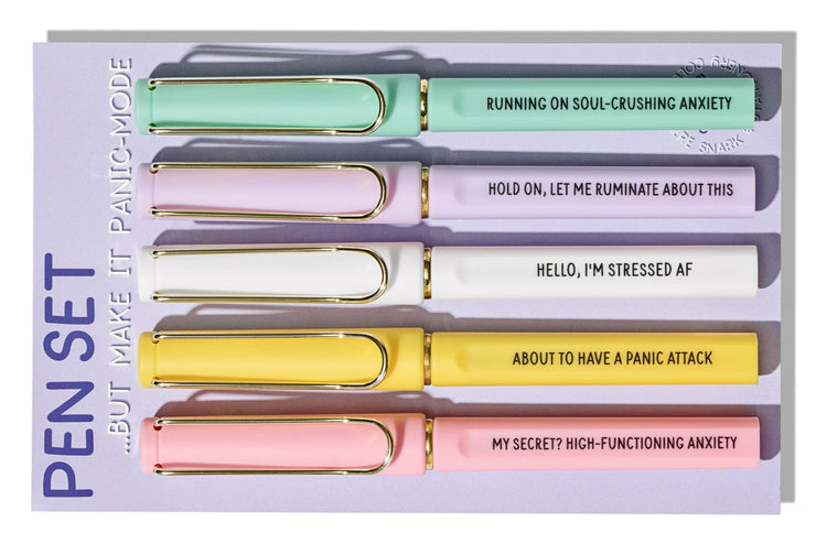 Pastel gel pens with gold accents and witty quotes about panic and anxiety, gift-ready stationery set.