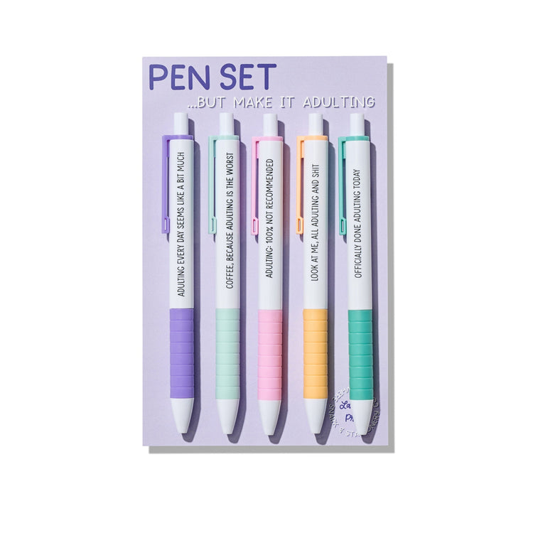 Adulting pen set with five pastel click pens featuring funny quotes about growing up, on backing card.