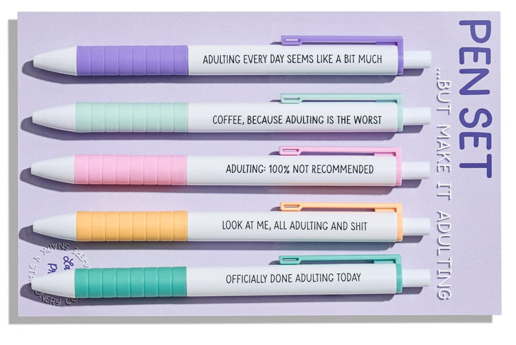 Adulting pen set with five pastel click pens featuring funny quotes about growing up, on backing card.