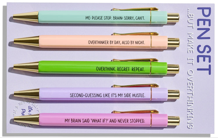 Funny pastel click pens with gold details and humorous overthinking quotes, packaged on backing card in cello sleeve.