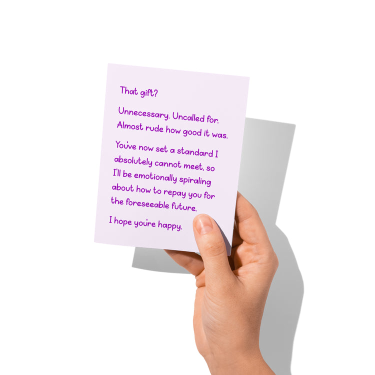 Hand holding the thank you card (front visible) to show size and print detail.