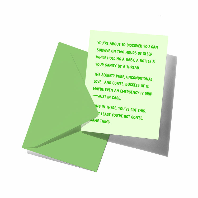 funny new parent card with matching envelope, back flap visible.