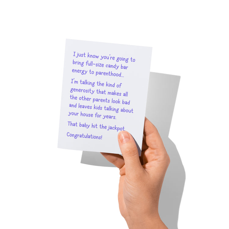 Funny new baby greeting card held in hand, witty congratulations for parents, blank inside.