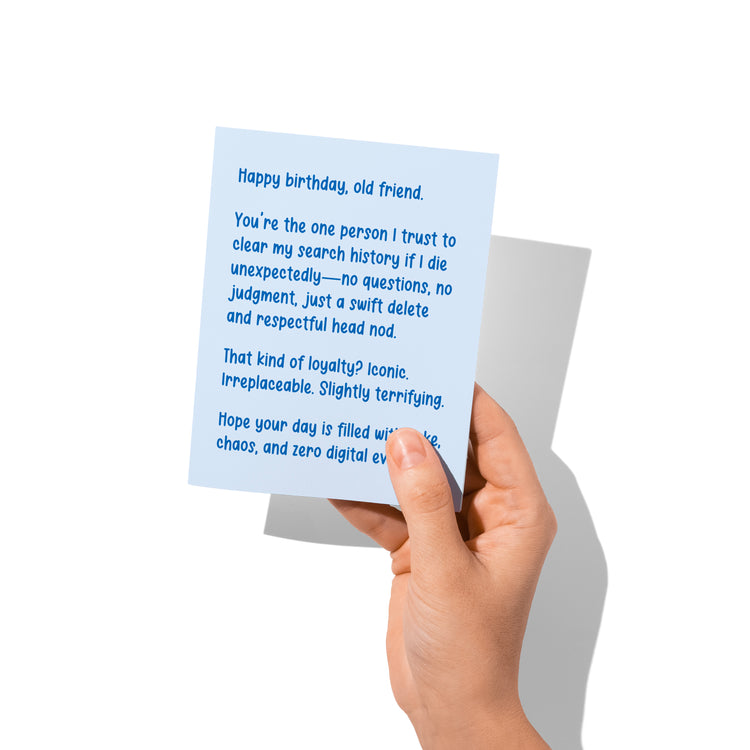 Funny birthday card held in hand, snarky best friend message visible.