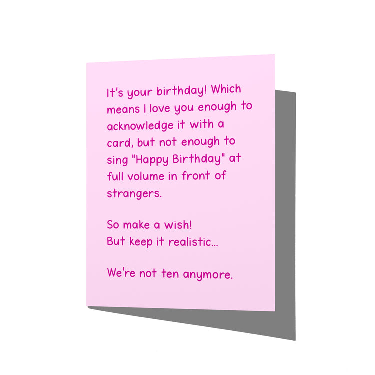 Funny birthday card with witty snarky humor message on front, blank inside.