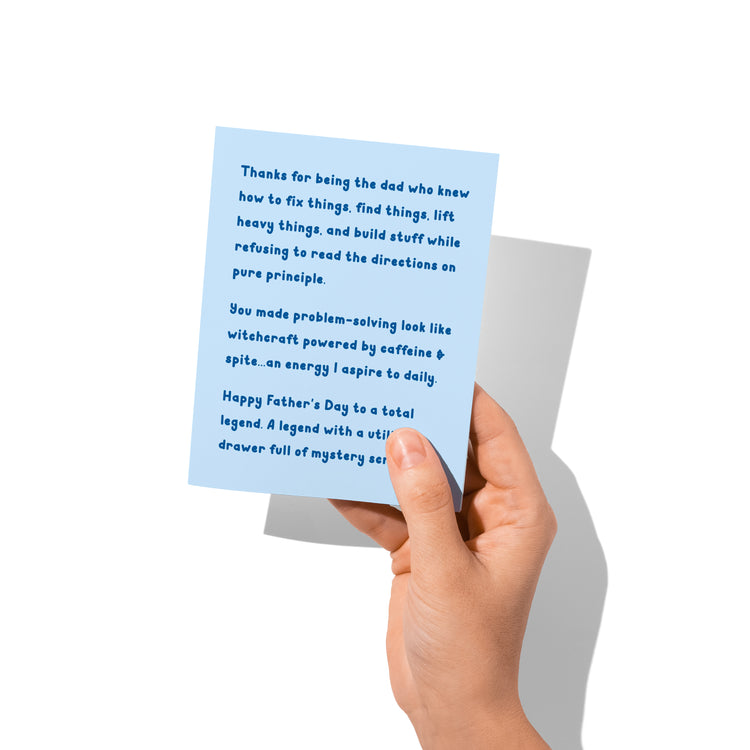 Funny Father’s Day card held in hand, humorous handyman dad design visible.