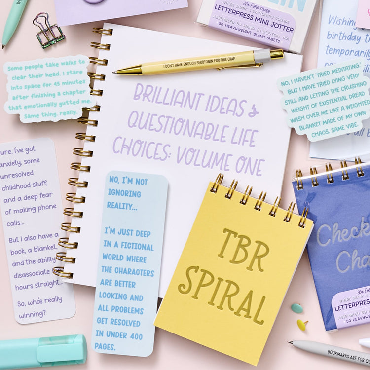 Humorous letterpress journal with lavender text and gold Wire-O binding, perfect for big ideas and messy choices.