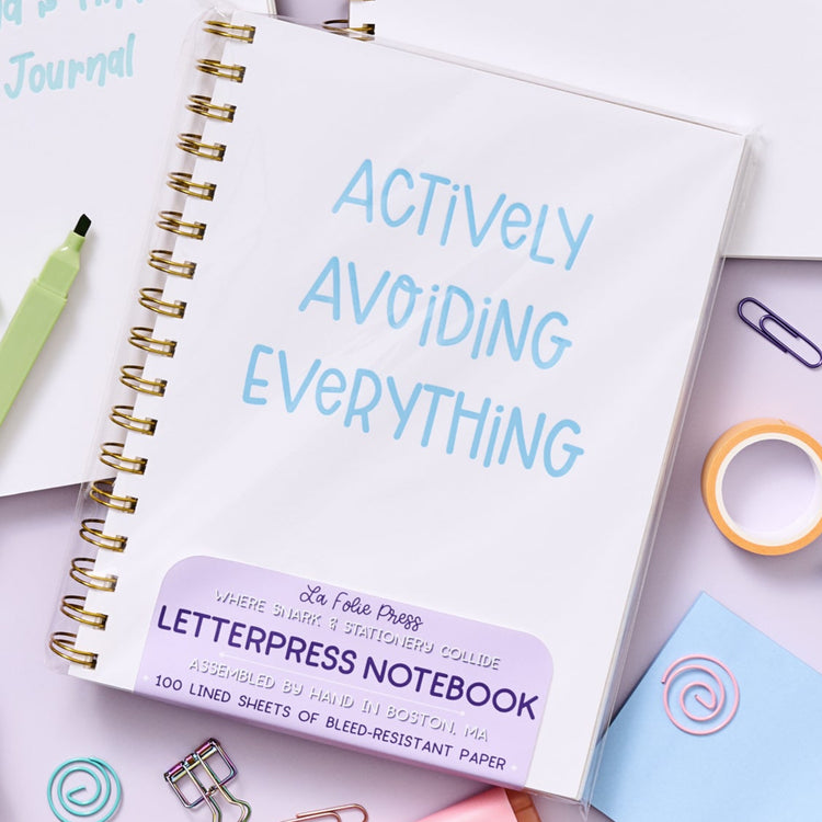 Funny spiral notebook with blue lettering for procrastinators and avoiders.