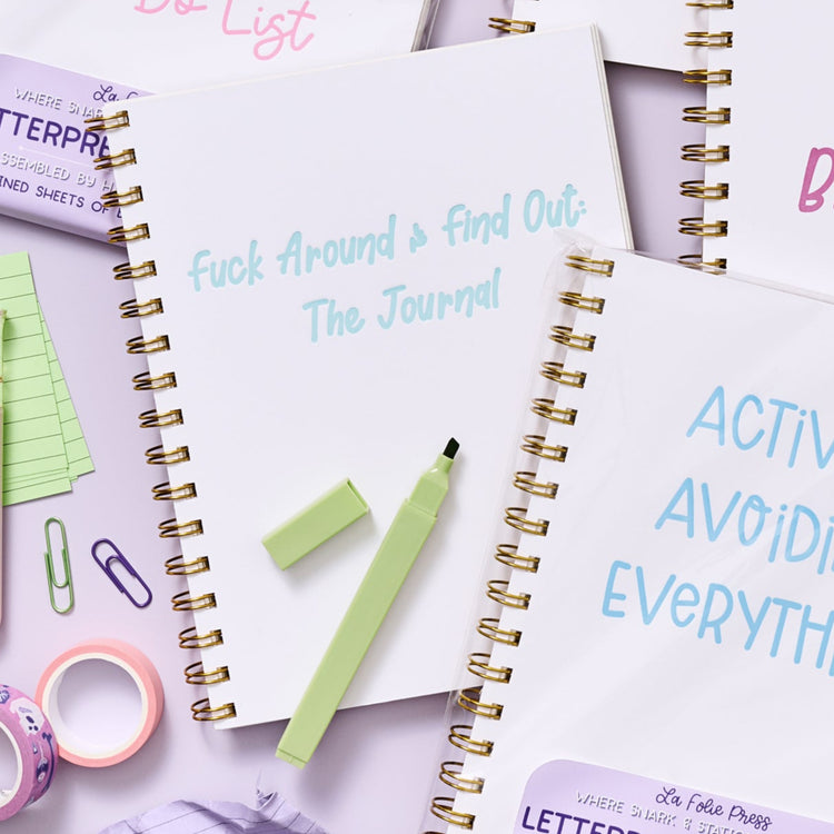 Funny and bold spiral notebook featuring snarky phrase “Fuck Around & Find Out: The Journal.”