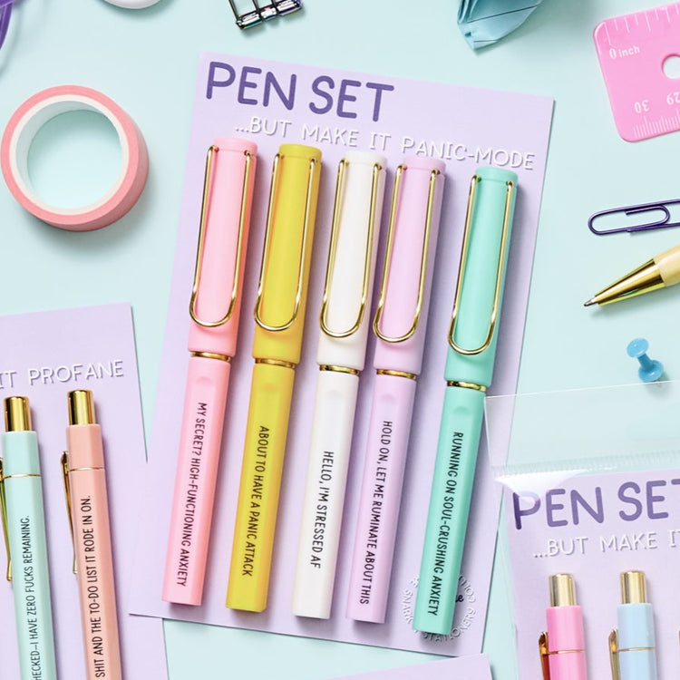 Funny gel pens with black ink and humorous stress-related phrases, packaged in a 5-pack set.