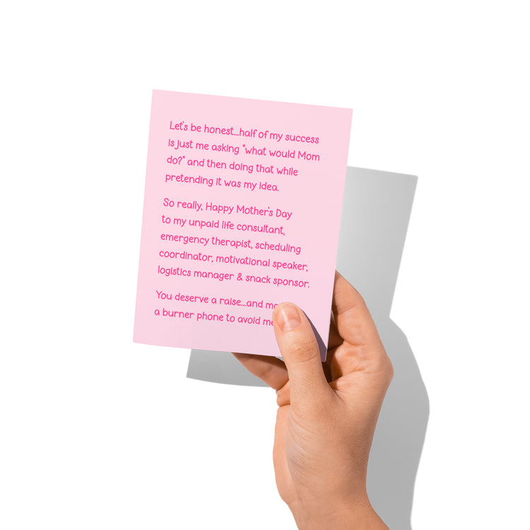 Funny Mother’s Day card held in hand, humorous mom message visible.