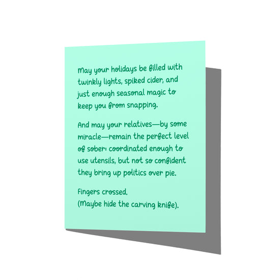Funny holiday card with witty dysfunctional family humor message on front, blank inside.