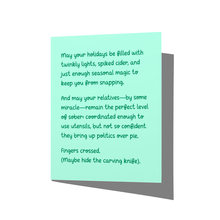 Funny holiday card with witty dysfunctional family humor message on front, blank inside.