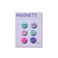 Spiraling Magnet Set with six colorful one-inch magnets on backing card