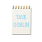 Mini jotter notebook with blue letterpress text “Task Goblin” on rigid white cover and gold spiral binding.