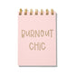 Pink letterpress mini jotter with gold text “Burnout Chic” and gold spiral binding.
