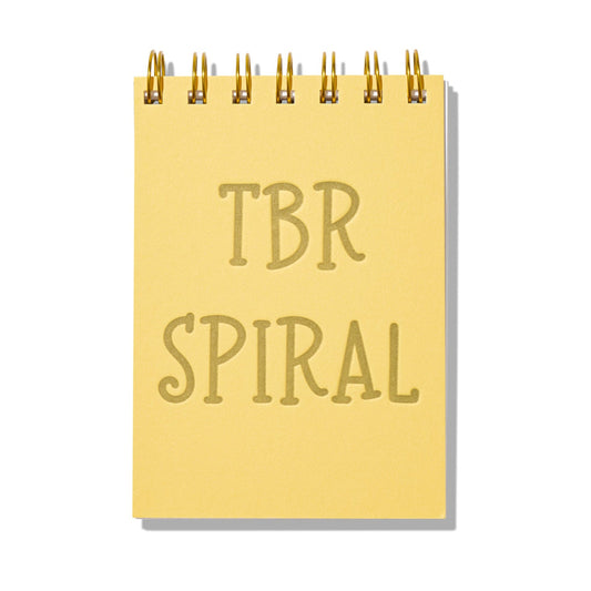 Yellow mini jotter with letterpress text “TBR Spiral” and gold spiral binding.
