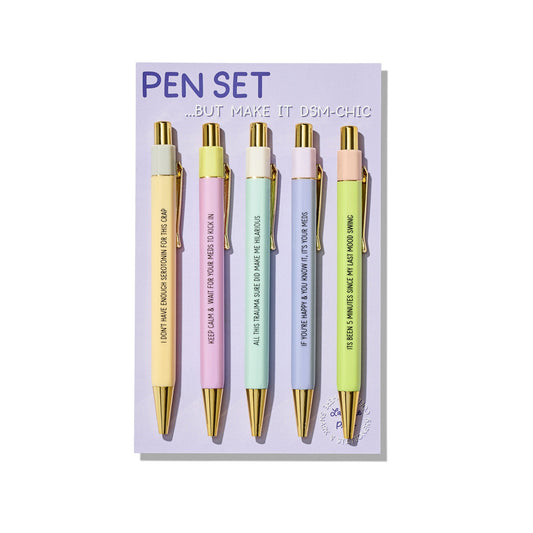 Pastel click pens with humorous mental health phrases, packaged as DSM-Chic pen set.
