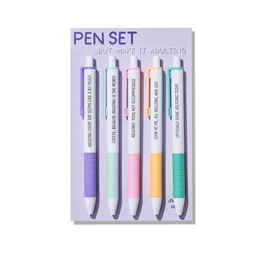 Adulting pen set with five pastel click pens featuring funny quotes about growing up, on backing card.