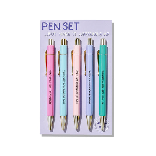 Funny pastel click pens with gold details and humorous quotes about people-pleasing, packaged on backing card in cello sleeve.