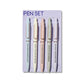 Bookish pen set of 5 ballpoint pens with funny reader quotes, displayed on a purple backing card with pastel pens and rose gold accents.