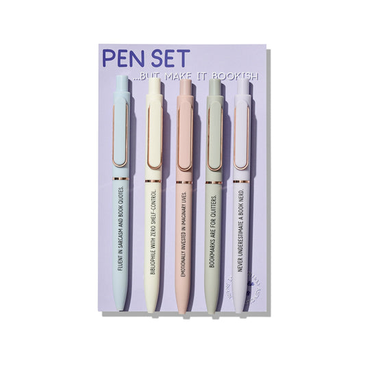 Bookish pen set of 5 ballpoint pens with funny reader quotes, displayed on a purple backing card with pastel pens and rose gold accents.