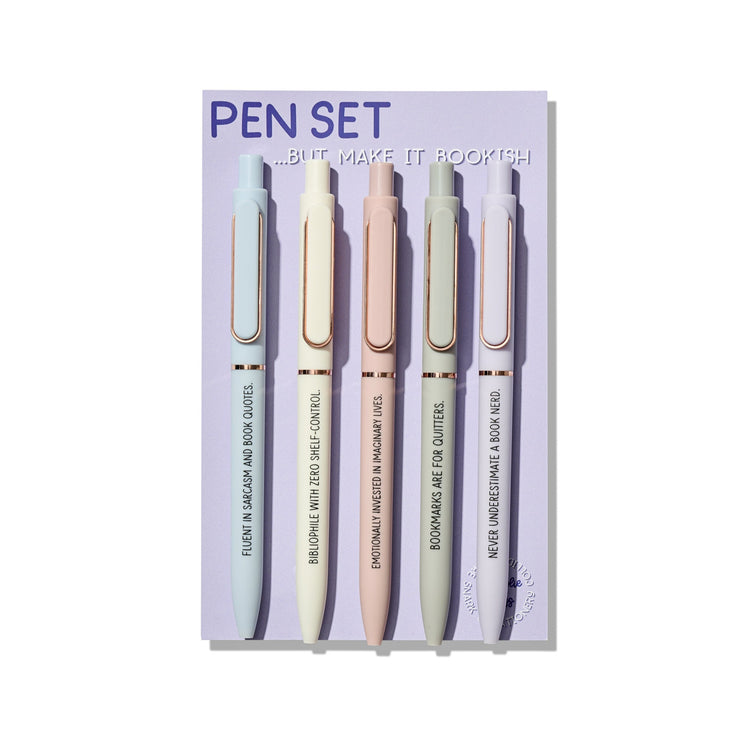 Bookish pen set of 5 ballpoint pens with funny reader quotes, displayed on a purple backing card with pastel pens and rose gold accents.