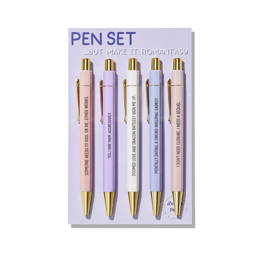Romantasy pen set of 5 ballpoint pens with funny bookish quotes, displayed on a purple backing card with gold accents.