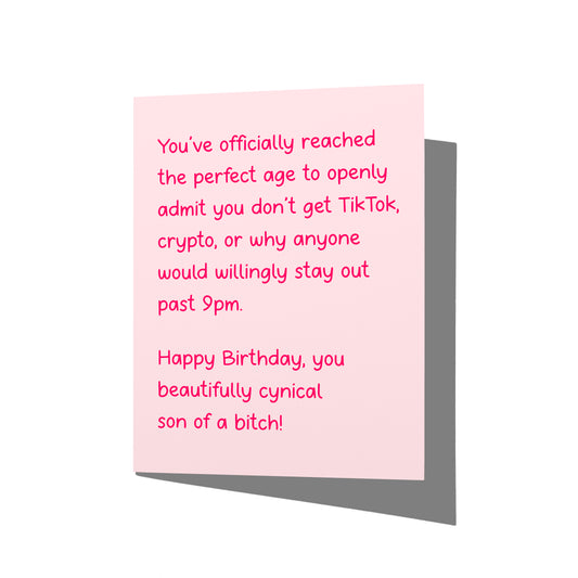 Funny birthday card with cynical adult humor message on front, blank inside.