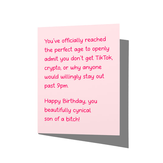 Funny birthday card with cynical adult humor message on front, blank inside.