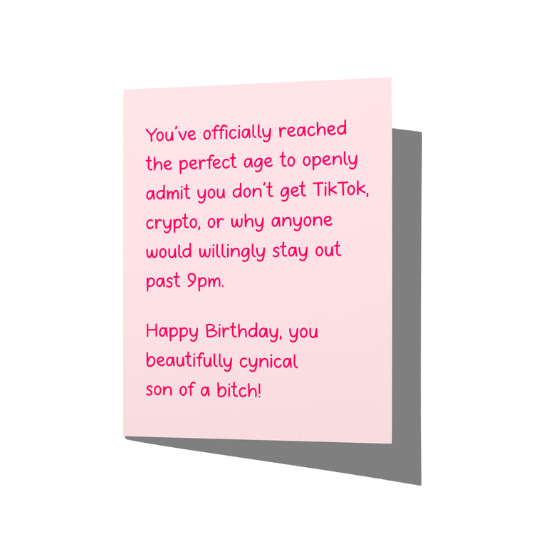 Funny birthday card with cynical adult humor message on front, blank inside.