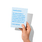 Funny congrats card held in hand, humorous snarky congrats message visible.