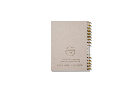 Rigid notebook backing with letterpress logo.