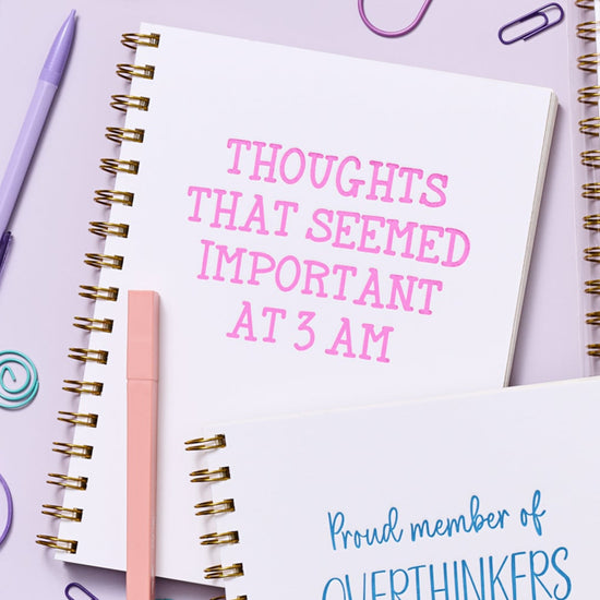 Funny 3 AM thoughts notebook with letterpress design, rigid matboard cover, and gold spiral binding.